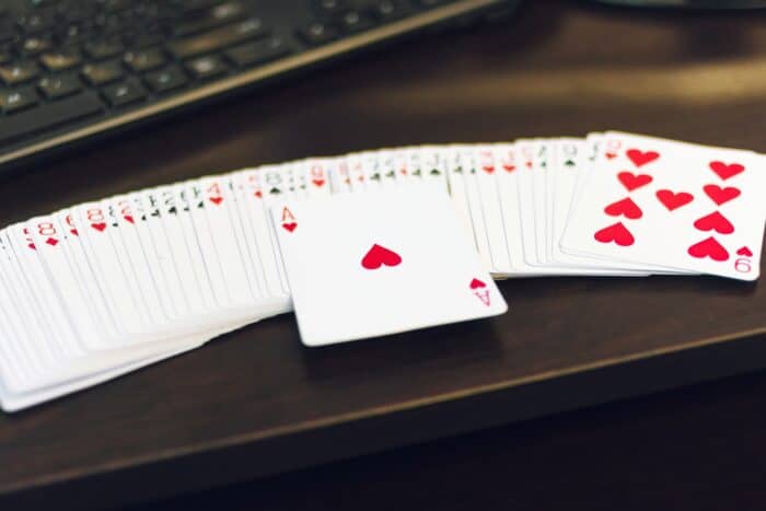 Poker cards on the table in front of the poker AI interface: real-time combination analysis