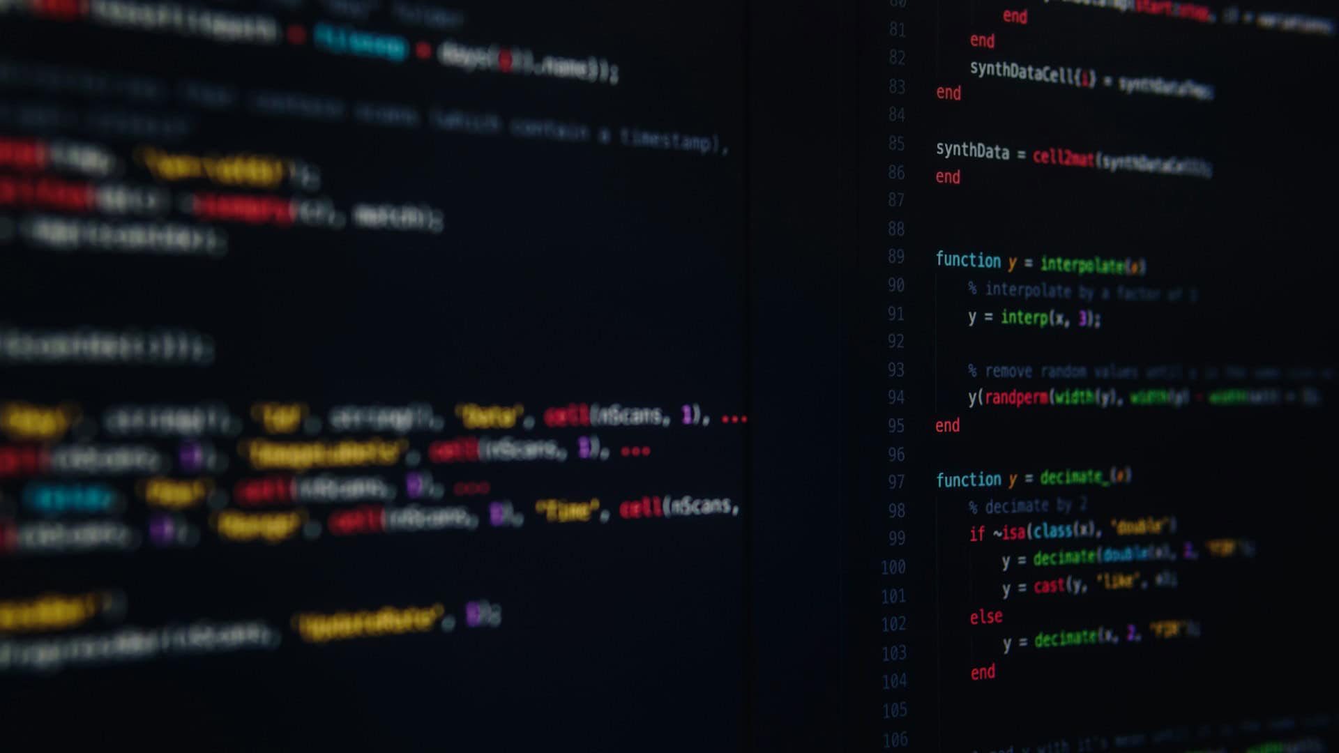 Close-up view of colorful programming code on a dark screen, representing algorithms and neural networks used in poker AI development.