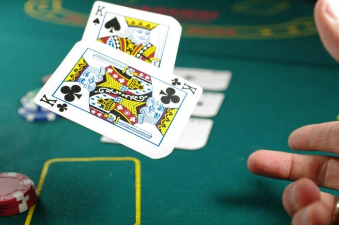 Player at poker table illustrating bluffing in Leduc Hold'em by AI